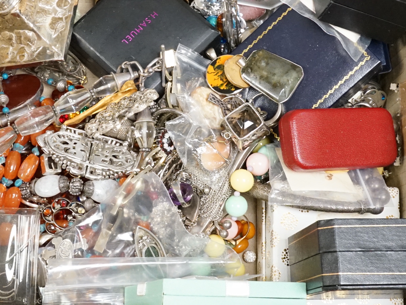 A quantity of assorted jewellery, including silver, white metal and costume and a pair of silver mounted dwarf candlesticks(a.f.).
